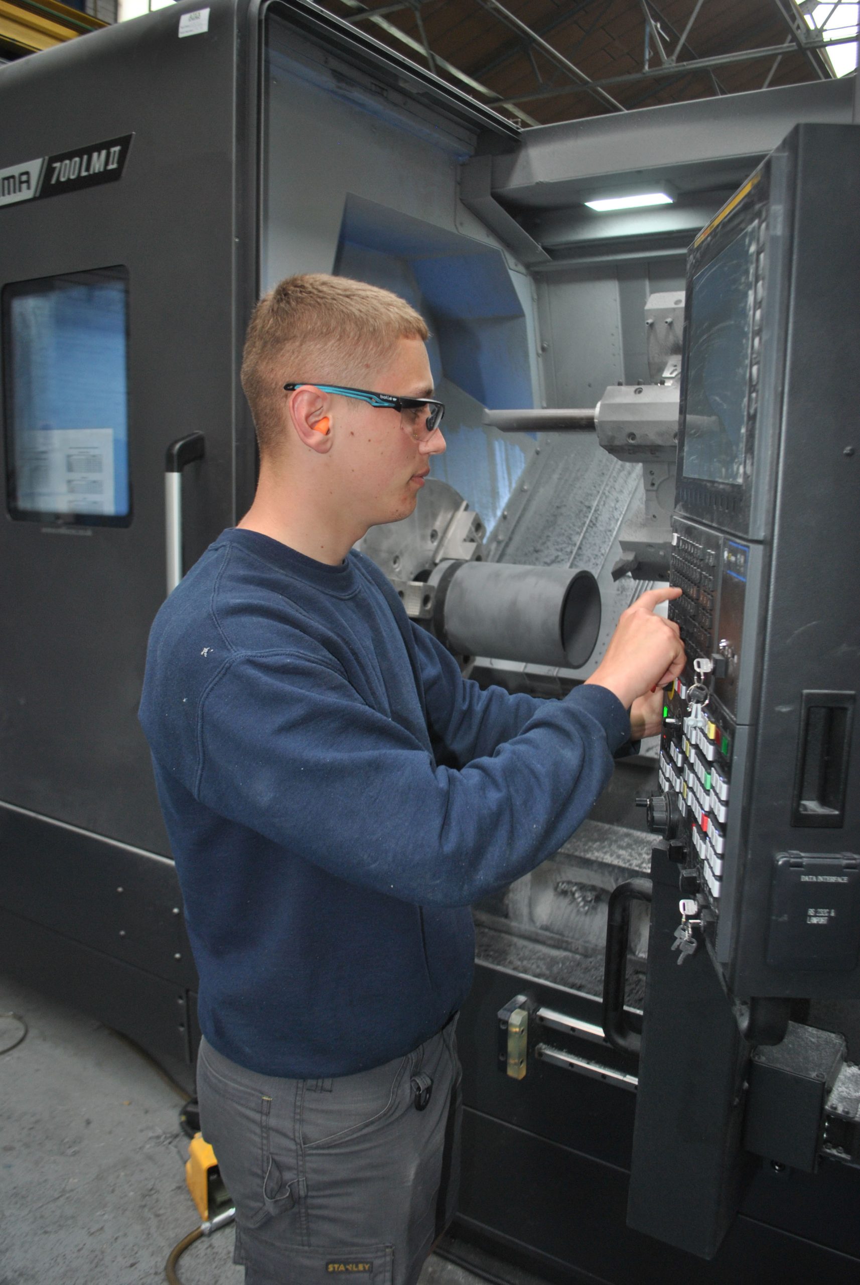 Operator using a Puma 700LM II large-capacity, multi-tasking lathe at Tufcot Engineering