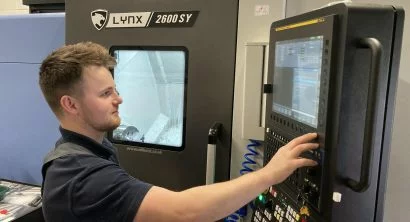 Macro Manufacturing’s owner and director, Matthew Forbes with the Fanuc-controlled DN Solutions’ sub-spindle, Y-axis Lynx 2600SY