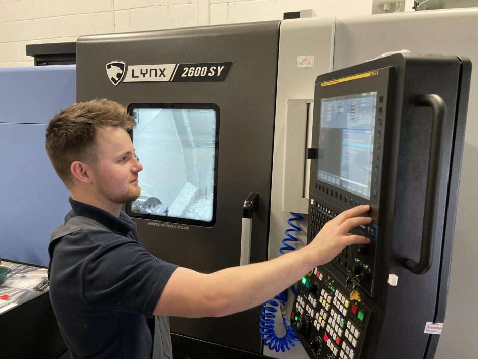 Macro Manufacturing’s owner and director, Matthew Forbes with the Fanuc-controlled DN Solutions’ sub-spindle, Y-axis Lynx 2600SY